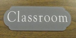 Reverse engraved laser cut specialty sign